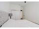 Bright bedroom with plush headboard and ample closet space at 3371 Dogwood Dr # 120, Hapeville, GA 30354