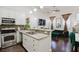 Open concept kitchen with granite countertops and breakfast bar at 3371 Dogwood Dr # 120, Hapeville, GA 30354