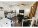 Open living room and kitchen with dark floors and green sofa at 3371 Dogwood Dr # 120, Hapeville, GA 30354