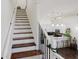 Elegant staircase leading to upper level with kitchen view at 3371 Dogwood Dr # 120, Hapeville, GA 30354