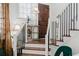 Interior view of staircase with dark wood and white railings at 3371 Dogwood Dr # 120, Hapeville, GA 30354