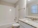 Bathroom with granite countertop, white vanity, and shower/tub combo at 6179 Dana Ct, Lithonia, GA 30058