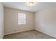 Spacious bedroom with neutral walls and carpet flooring at 6179 Dana Ct, Lithonia, GA 30058