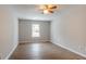 Spacious bedroom with wood-look flooring and ceiling fan at 6179 Dana Ct, Lithonia, GA 30058