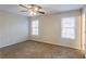 Primary bedroom with ceiling fan and carpet flooring at 6179 Dana Ct, Lithonia, GA 30058