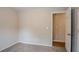 Bedroom with carpet flooring and access to a hallway at 6179 Dana Ct, Lithonia, GA 30058