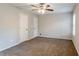 Primary bedroom with ceiling fan and carpet flooring at 6179 Dana Ct, Lithonia, GA 30058