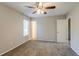 Primary bedroom with ceiling fan and carpet flooring at 6179 Dana Ct, Lithonia, GA 30058