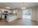 Kitchen and dining area with hardwood floors and access to backyard at 6179 Dana Ct, Lithonia, GA 30058