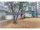 Two-story house with gray siding, red door, and attached garage at 6179 Dana Ct, Lithonia, GA 30058