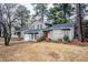 Gray sided two story house with red front door and attached garage at 6179 Dana Ct, Lithonia, GA 30058