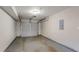 Attached garage with automatic opener and concrete floor at 6179 Dana Ct, Lithonia, GA 30058