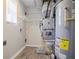 Laundry room with shelving, HVAC unit, and water heater at 6179 Dana Ct, Lithonia, GA 30058