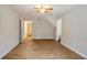 Bright living room featuring wood-look floors and access to hallway at 6179 Dana Ct, Lithonia, GA 30058