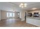 Open living room features hardwood floors, and a view into the kitchen at 6179 Dana Ct, Lithonia, GA 30058