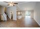 Open living room and kitchen with hardwood floors and access to back patio at 6179 Dana Ct, Lithonia, GA 30058