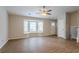 Spacious living room with hardwood floors, bay window, and ceiling fan at 6179 Dana Ct, Lithonia, GA 30058