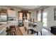 Farmhouse dining room with a large wooden table and six chairs at 12030 Conrad Circle, Hampton, GA 30228