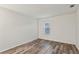 Bright bedroom with wood-look floors and large window at 1608 Vicksburg Pl, Atlanta, GA 30350