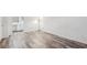 Spacious bedroom with stylish flooring, a view to the ensuite bathroom, and a minimalist aesthetic at 1608 Vicksburg Pl, Sandy Springs, GA 30350