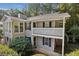 Two-story building with gray siding, balcony, and landscaping at 1608 Vicksburg Pl, Sandy Springs, GA 30350