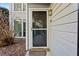 Charming home front door with decorative trim, adjacent window, and attractive exterior paint at 1608 Vicksburg Pl, Sandy Springs, GA 30350