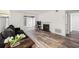 Open living room with hardwood floors, neutral colors, and fireplace feature at 1608 Vicksburg Pl, Sandy Springs, GA 30350
