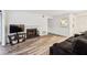 Spacious living room featuring hardwood floors, fireplace, and neutral paint colors at 1608 Vicksburg Pl, Sandy Springs, GA 30350