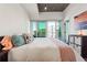 Comfortable bedroom with balcony access and city view at 250 Pharr Rd # 1707, Atlanta, GA 30305