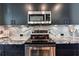 A well-equipped kitchen with stainless steel appliances, granite countertops, and ample storage space at 250 Pharr Rd # 1707, Atlanta, GA 30305