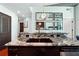 Kitchen island featuring granite countertops and a stainless steel sink, ideal for meal preparation and entertaining at 250 Pharr Rd # 1707, Atlanta, GA 30305