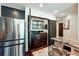 Convenient laundry area with modern washer and dryer, next to kitchen with stainless steel refrigerator at 250 Pharr Rd # 1707, Atlanta, GA 30305
