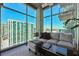 Bright living room with city views and comfortable seating at 250 Pharr Rd # 1707, Atlanta, GA 30305