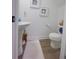 Charming bathroom with pedestal sink, toilet and decorative wall at 4940 Parke Brook Dr, Acworth, GA 30101