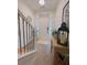 Open entryway with LVP flooring, stairs, and a console table with decor at 4940 Parke Brook Dr, Acworth, GA 30101
