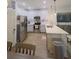 Modern kitchen with white cabinets, stainless steel appliances, and LVP flooring at 4940 Parke Brook Dr, Acworth, GA 30101
