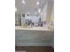Open kitchen boasts white cabinets, quartz countertops, and a breakfast bar at 4940 Parke Brook Dr, Acworth, GA 30101