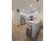 Bright kitchen featuring stainless steel appliances and an island with white quartz countertops at 4940 Parke Brook Dr, Acworth, GA 30101