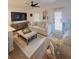 Spacious living room with neutral furniture, a large TV, and access to a patio at 4940 Parke Brook Dr, Acworth, GA 30101