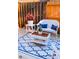 Relaxing patio with white wicker furniture and patterned rug at 4940 Parke Brook Dr, Acworth, GA 30101
