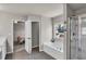 Main bathroom with soaking tub, walk-in shower, and double vanity at 210 Omega Ct, Dallas, GA 30157