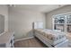 Small bedroom with a twin bed and a view of the backyard at 210 Omega Ct, Dallas, GA 30157