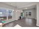 Spacious dining room featuring hardwood floors, chandelier, and natural light at 210 Omega Ct, Dallas, GA 30157