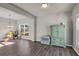 Bright dining room with hardwood floors, chandelier, and large windows at 210 Omega Ct, Dallas, GA 30157