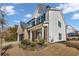 Two-story home with brick and white accents, landscaping, and a driveway at 210 Omega Ct, Dallas, GA 30157
