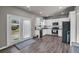 Modern kitchen with white cabinets, stainless steel appliances, and French doors to backyard at 210 Omega Ct, Dallas, GA 30157