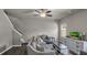 Living room with hardwood floors, ceiling fan, and view of kitchen at 210 Omega Ct, Dallas, GA 30157