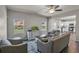 Spacious living room with hardwood floors, ceiling fan, and open floor plan at 210 Omega Ct, Dallas, GA 30157