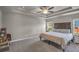 Main bedroom with large bed, neutral decor, and ample space at 210 Omega Ct, Dallas, GA 30157