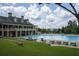 Large community pool with lounge chairs and clubhouse at 210 Omega Ct, Dallas, GA 30157
